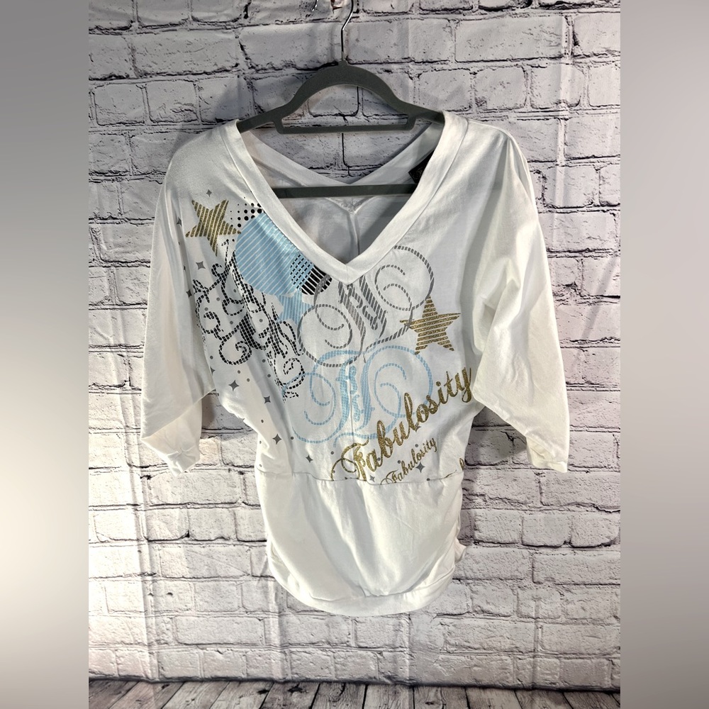 Fabulosity. Ladies pull on white with designs tunic top. Size Small.